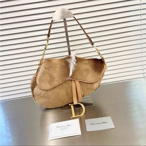 $2890 on site! Dior vintage Pony Hair Saddle Bag Brown